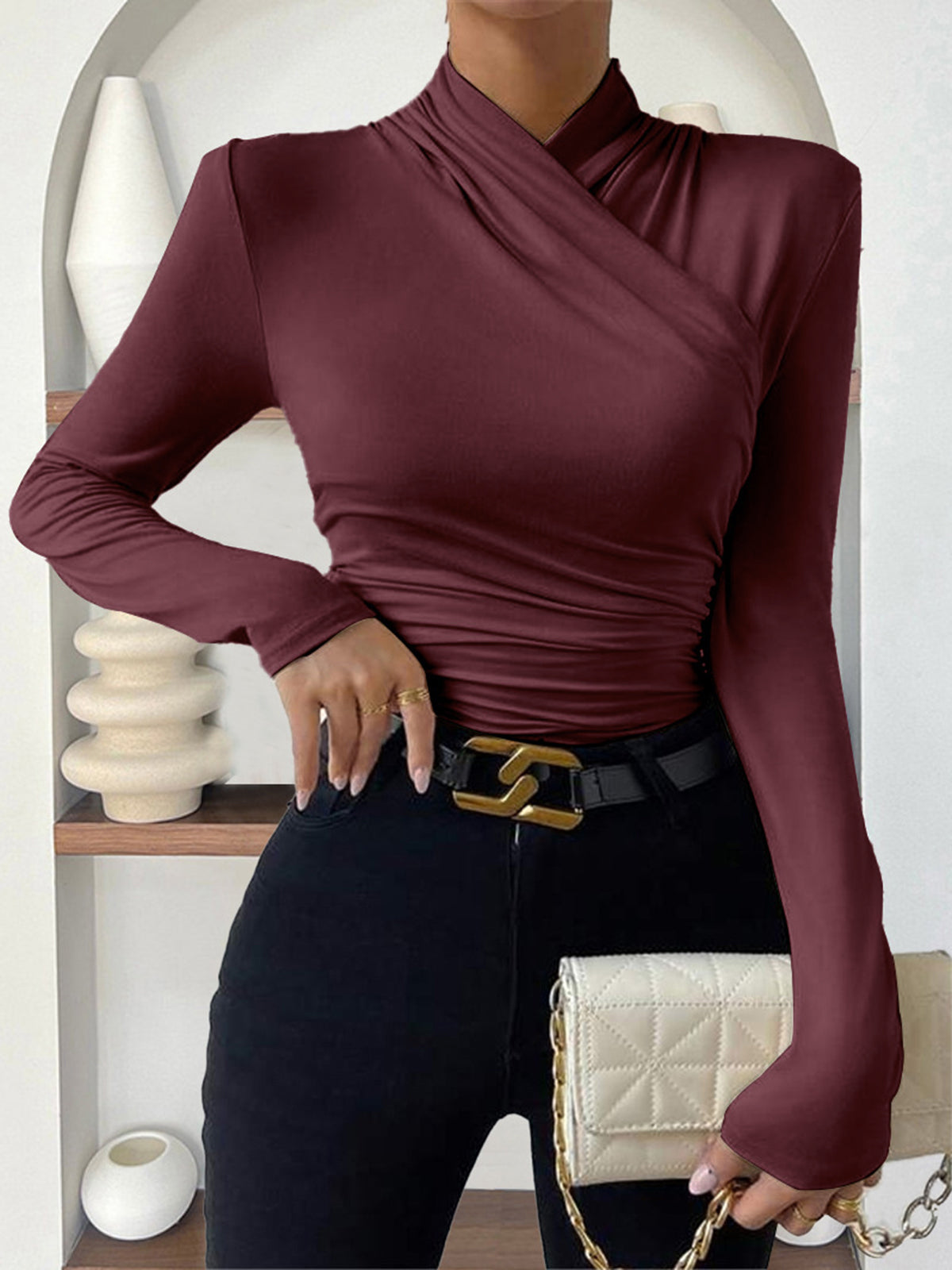 Burgundy mock-neck long-sleeve wrap top with ruched waist and crossover detail