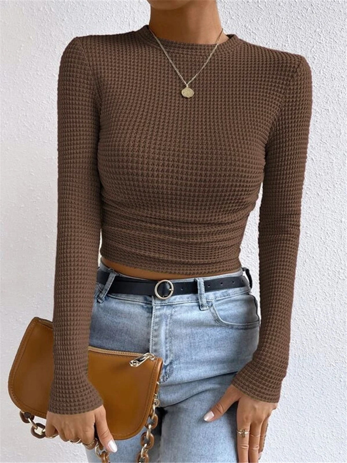 Light brown waffle knit long-sleeve crop top with ruched hem, slim fit