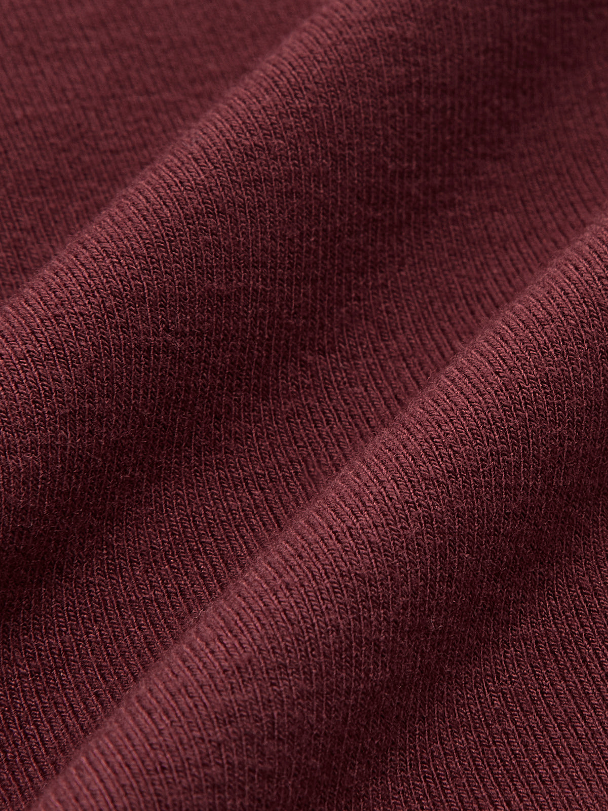 Burgundy ribbed knit top fabric detail