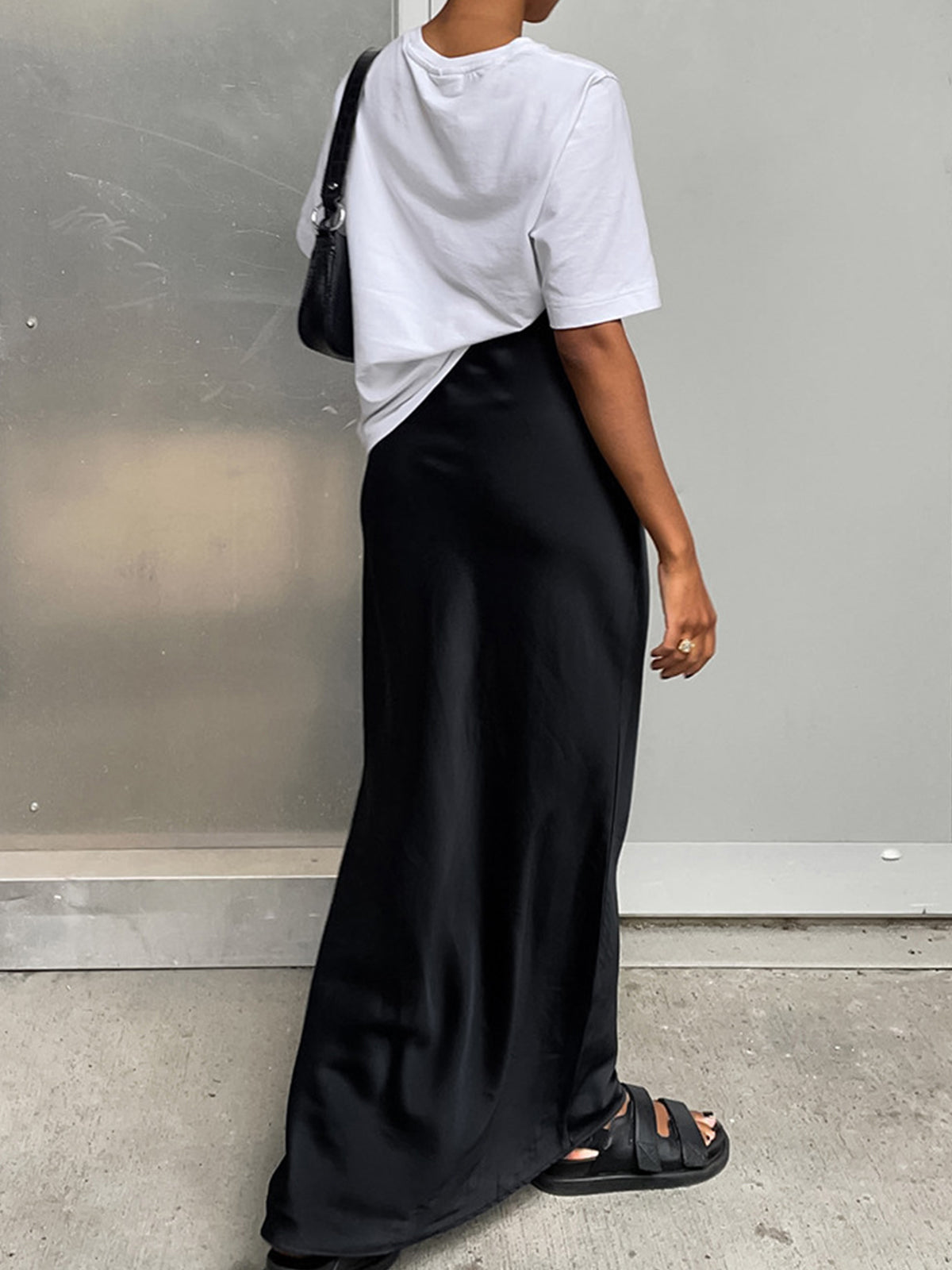 Black satin straight maxi skirt with high waist and side slit, full length