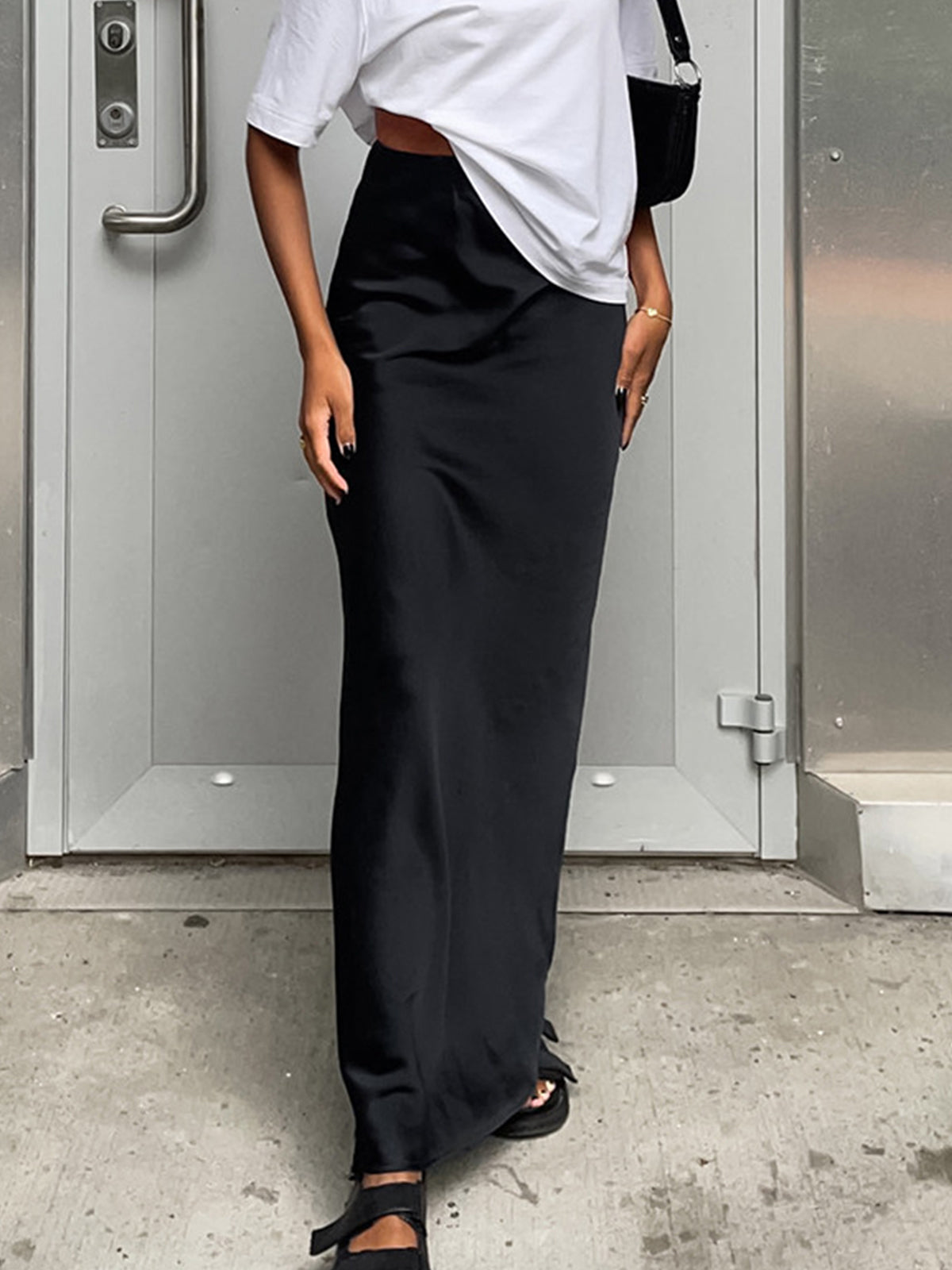 Black satin straight maxi skirt with high waist and side slit, floor length