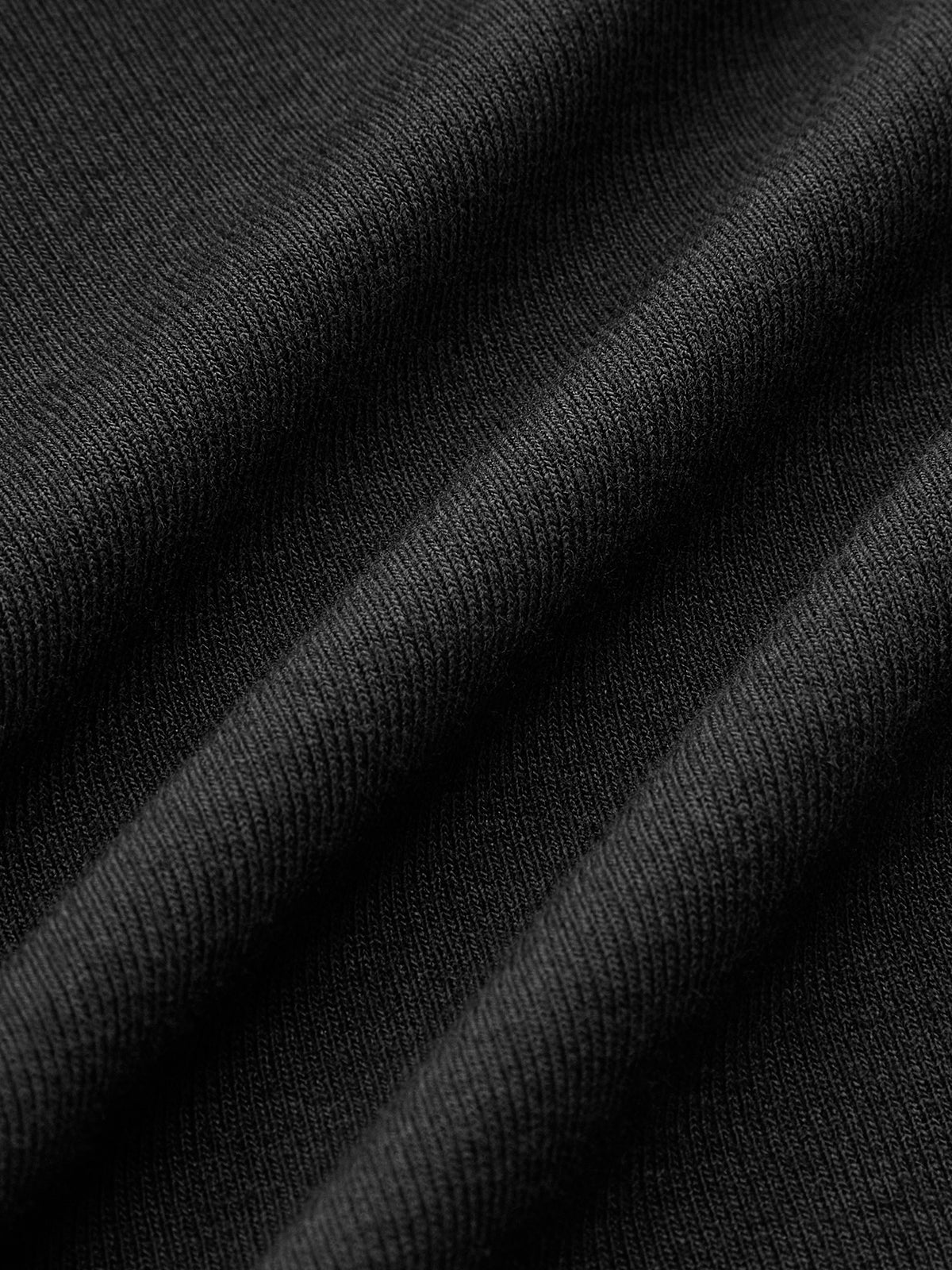 Charcoal viscose top fabric close-up with ribbed drape texture