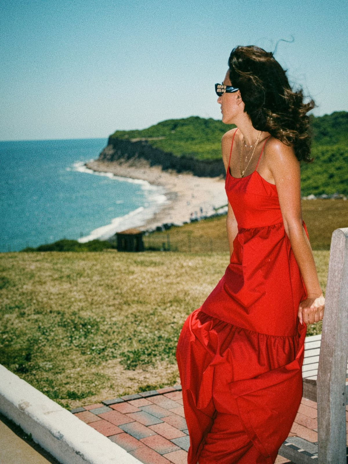 Red backless long dress with spaghetti straps and tiered skirt, open back