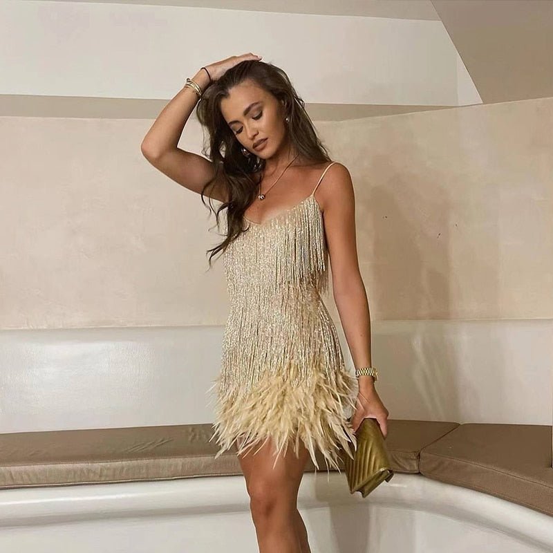 Gold crystal fringe mini dress with thin straps and layered feather hem