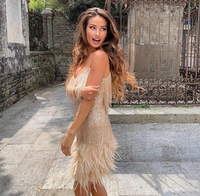 Gold-toned v-neck mini dress with thin straps, crystal fringe layers and feather trim