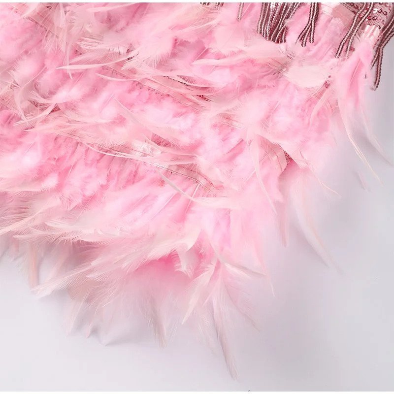 Pink V-neck mini fringe dress with layered feather hem and tassel body