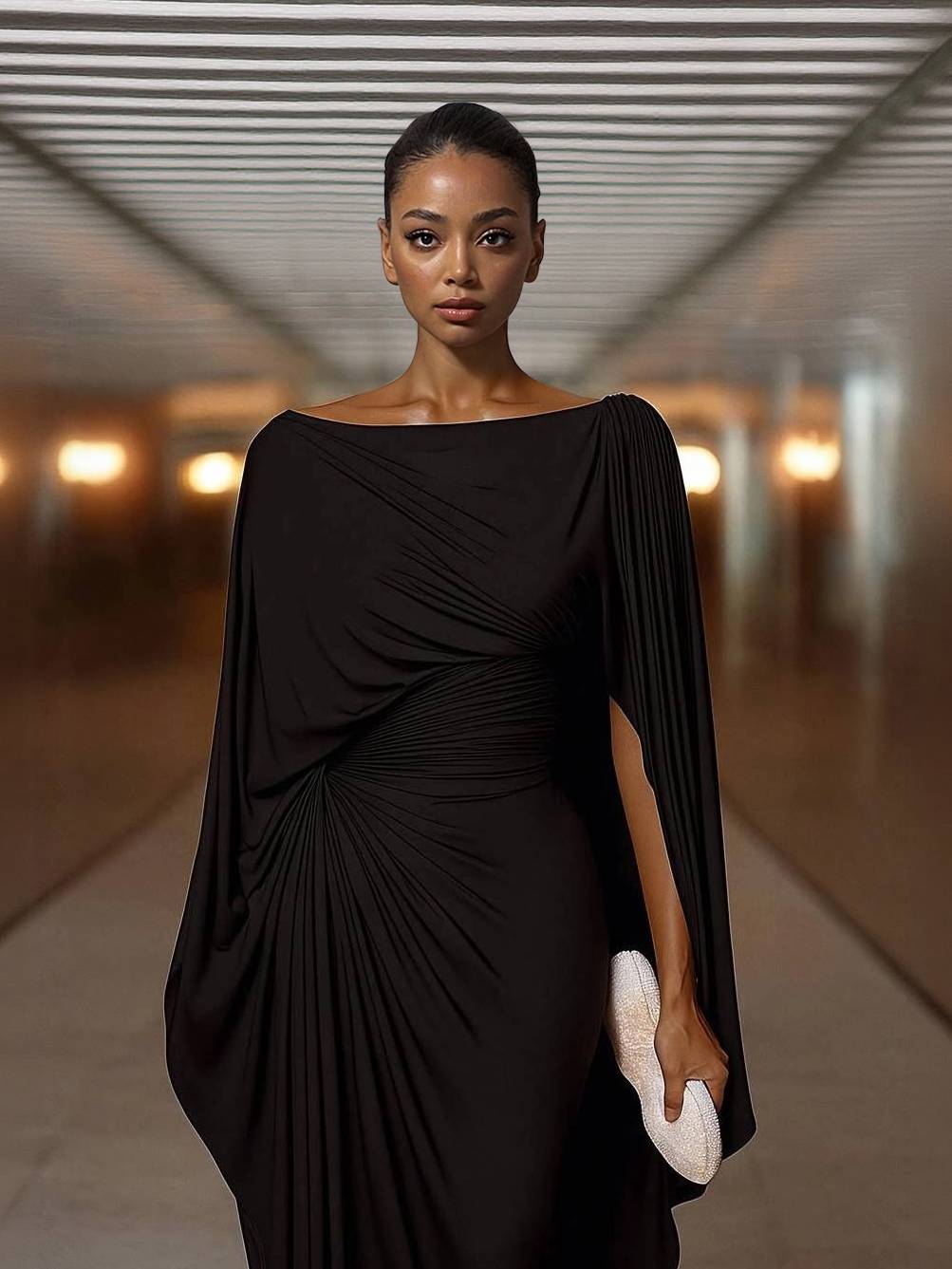 Black chiffon maxi dress with boat neck and draped cape sleeves over ruched waist