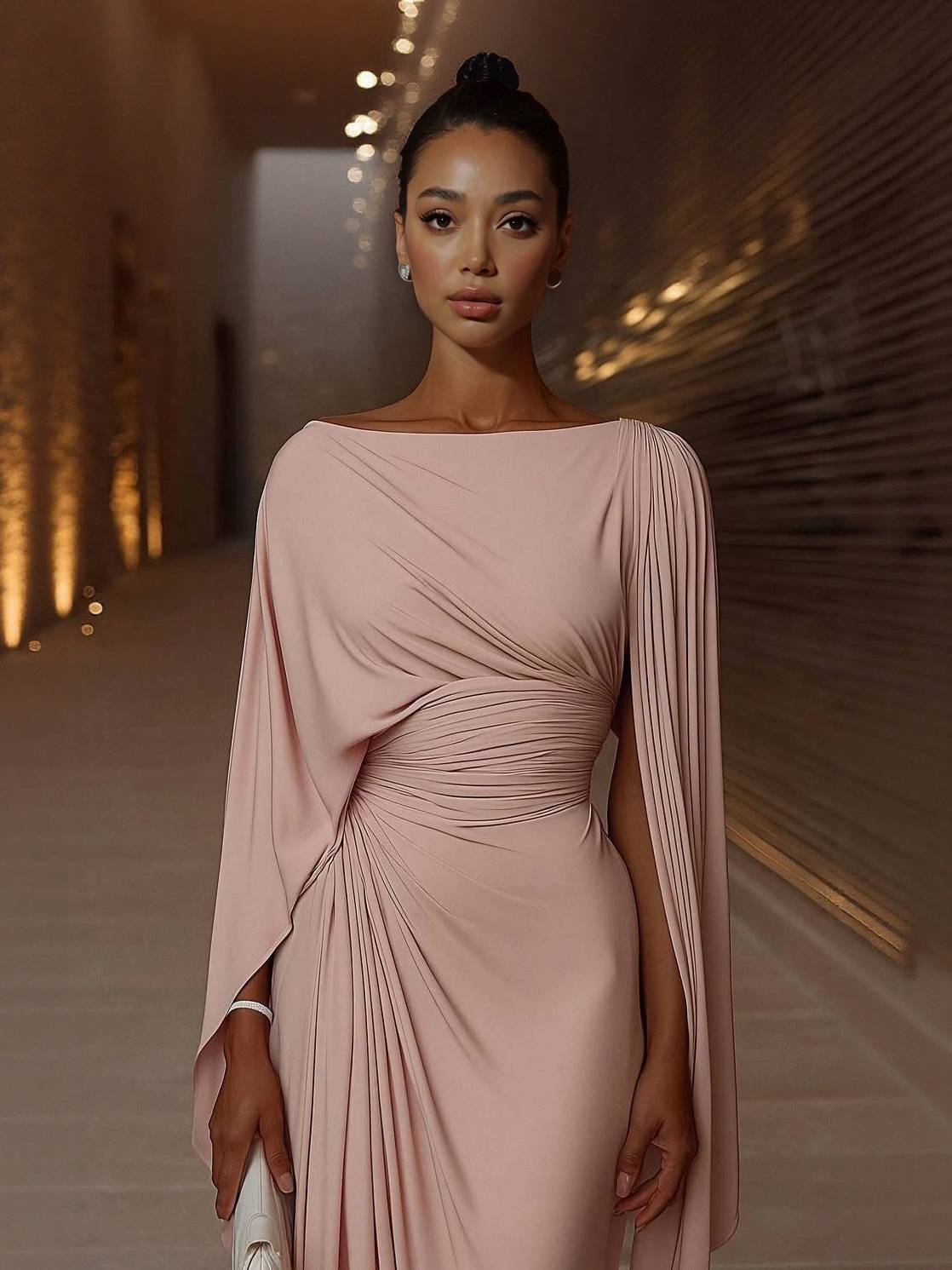 Blush pink chiffon maxi dress with boat neck, draped cape sleeves, and ruched waist