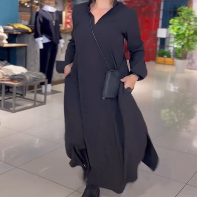 Black long-sleeve maxi dress with stand collar, loose fit, side pockets