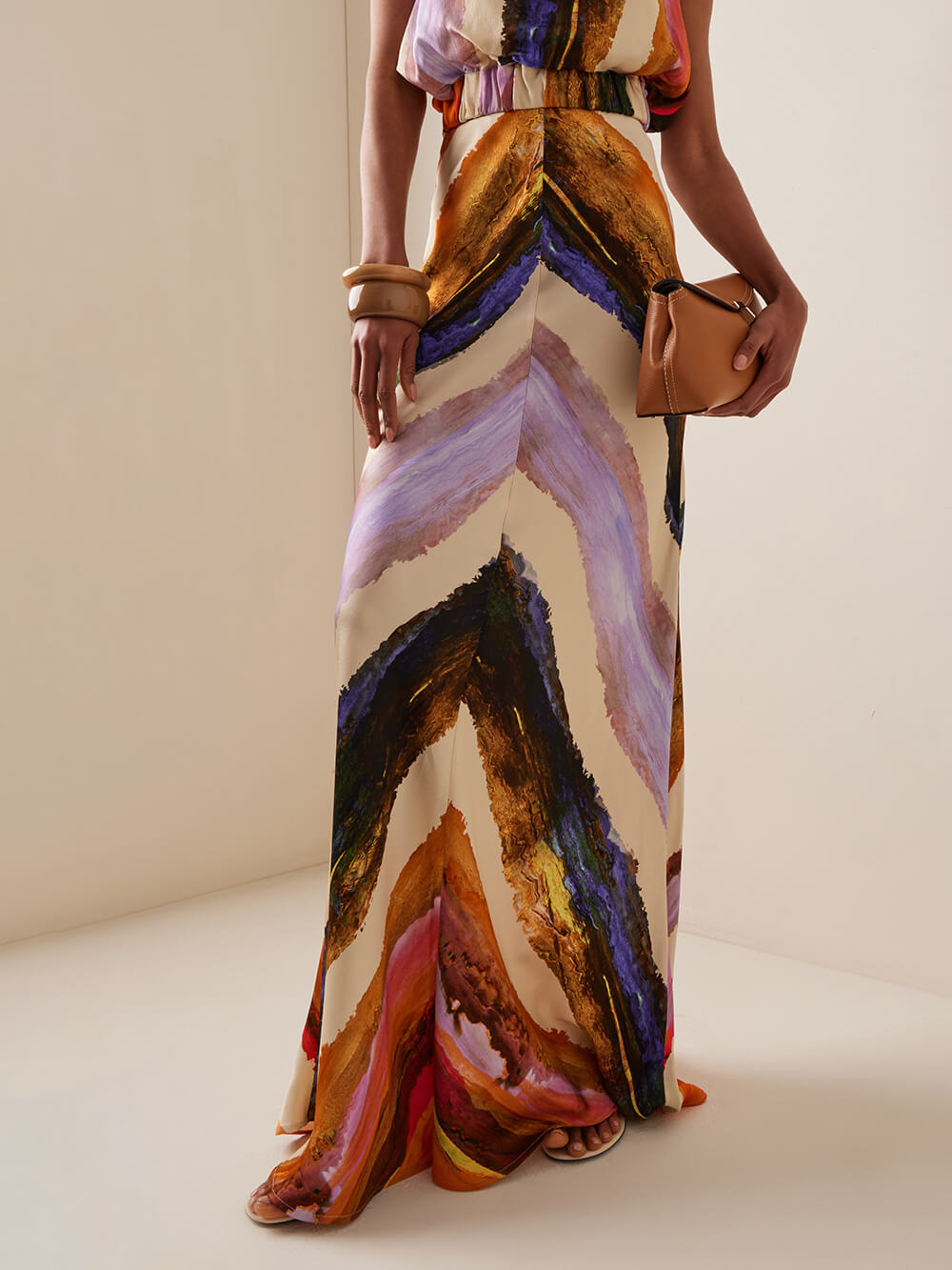 High-waist satin maxi skirt with multicolor abstract brushstroke print and front slit