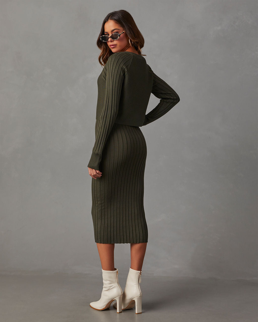 Dark olive ribbed knit midi dress with long sleeves, fitted back and straight hem