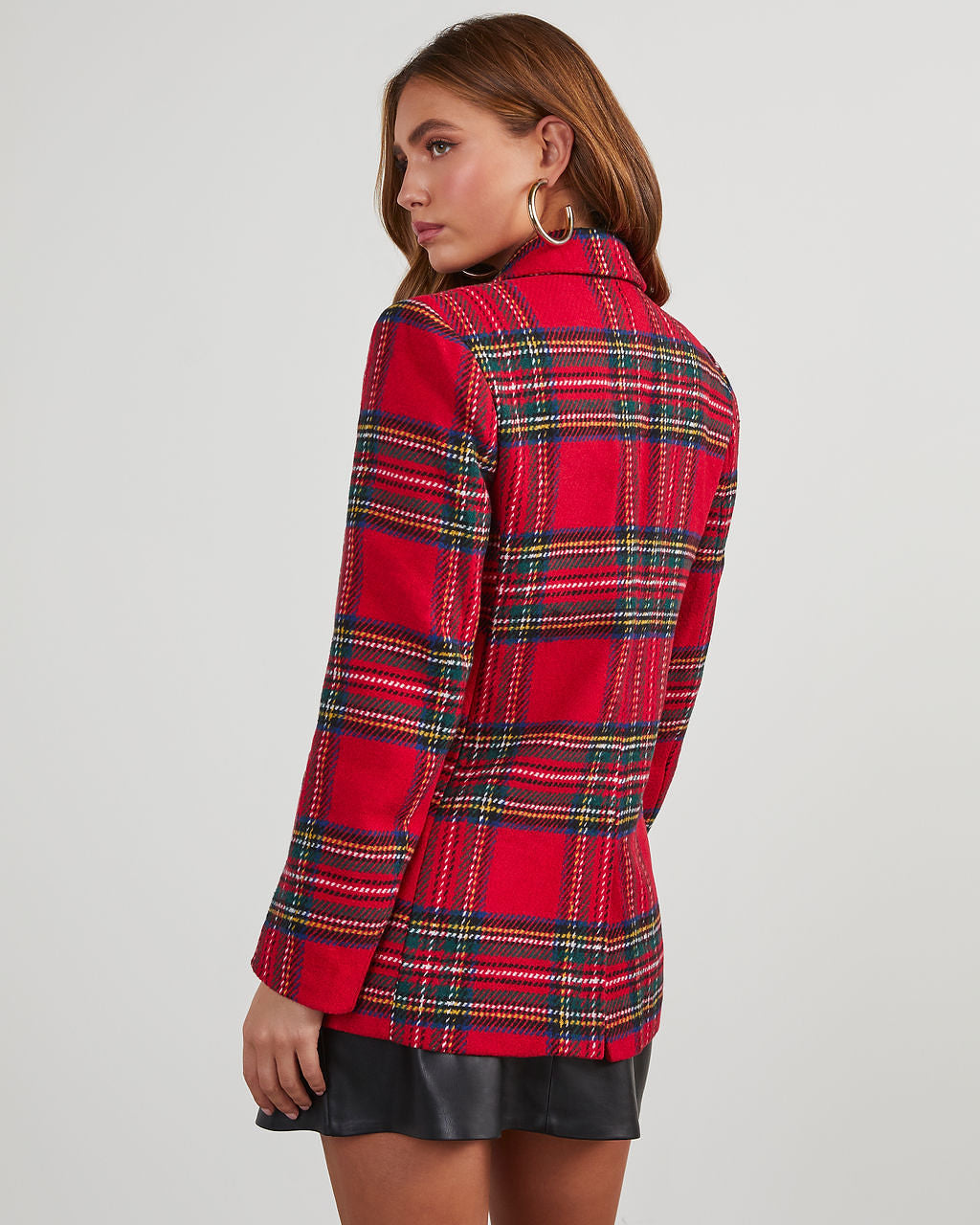 Back view of red and green plaid blazer with structured shoulders