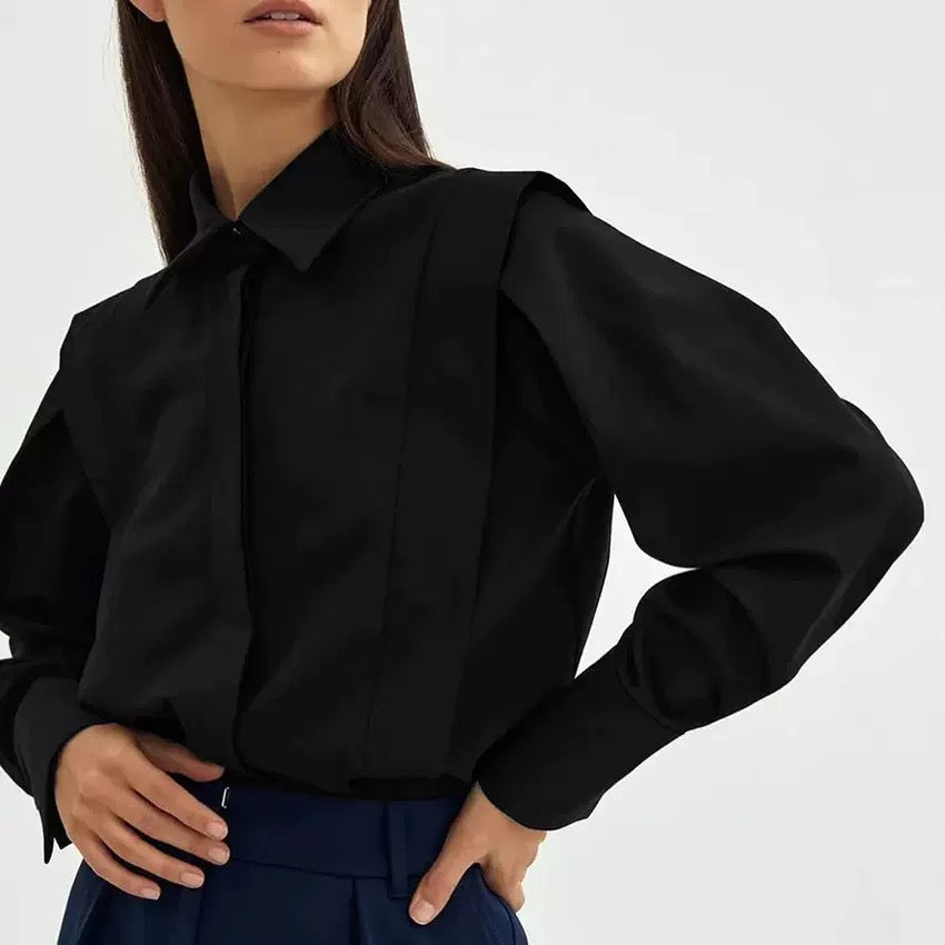 Black cotton oversized button-down blouse with long sleeves and power shoulders