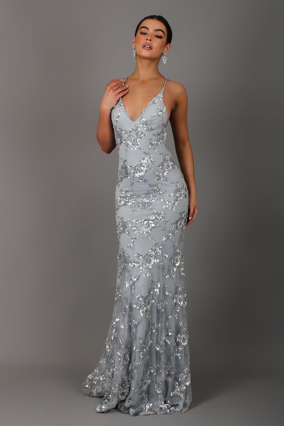 Silver sequin mermaid maxi gown with V-neck and thin straps, fitted fishtail