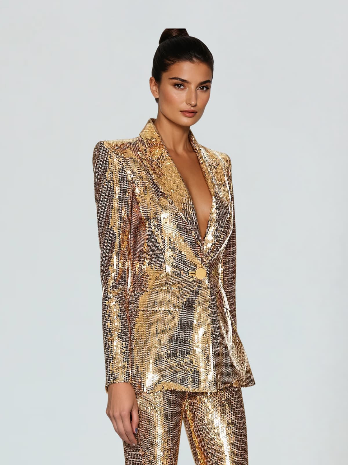 Gold sequin blazer and flare trousers suit, open V-neck, side profile