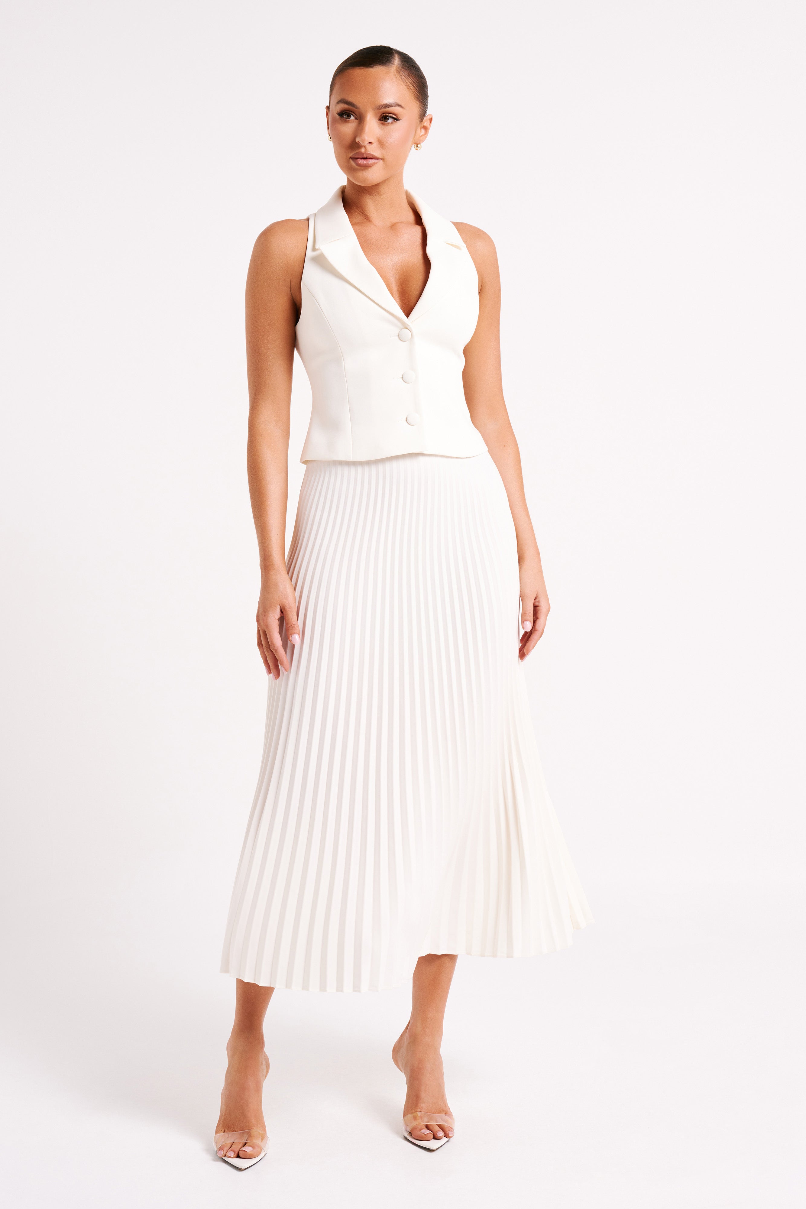 White sleeveless blazer mini dress with V notched lapel and pleated skirt