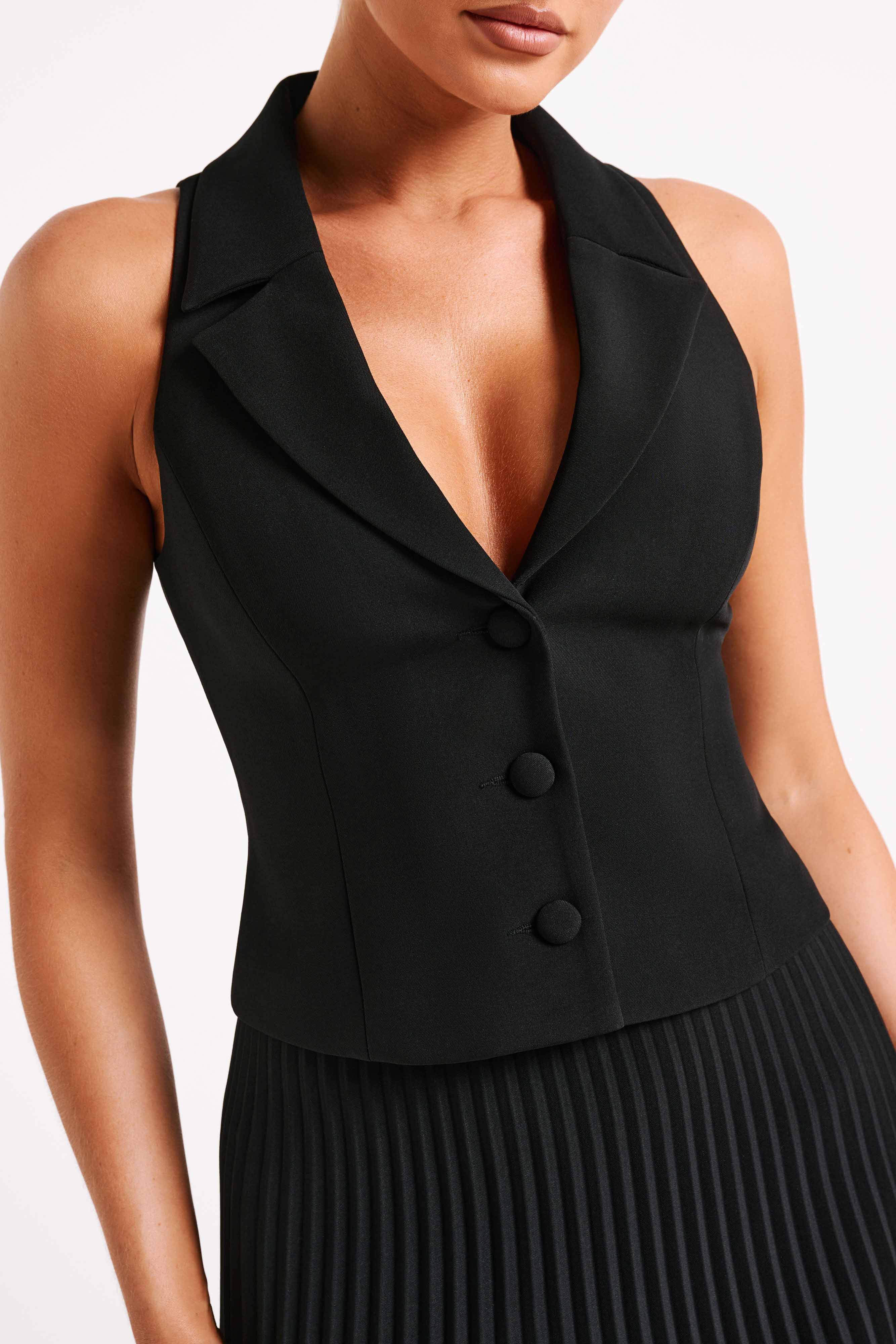 Black halter sleeveless blazer vest close-up with notch lapel and button front