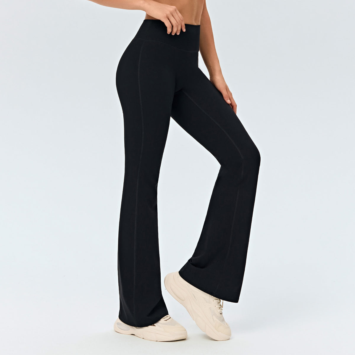 Black high-waisted flared yoga pants with wide legs and smooth drape