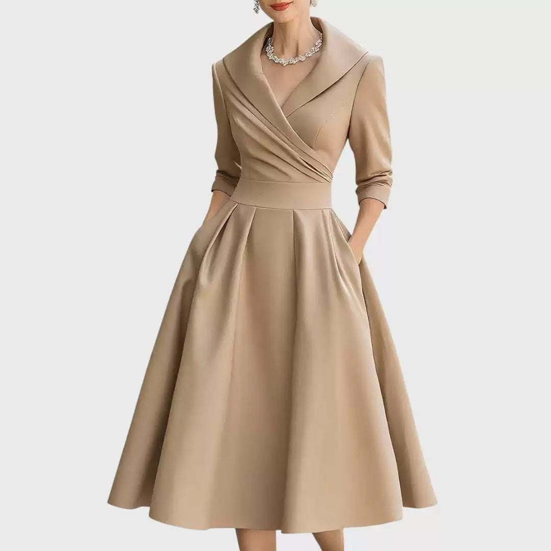 Women’s waist-cinching dress, beige, long sleeves, V-neck, flared A-line skirt.