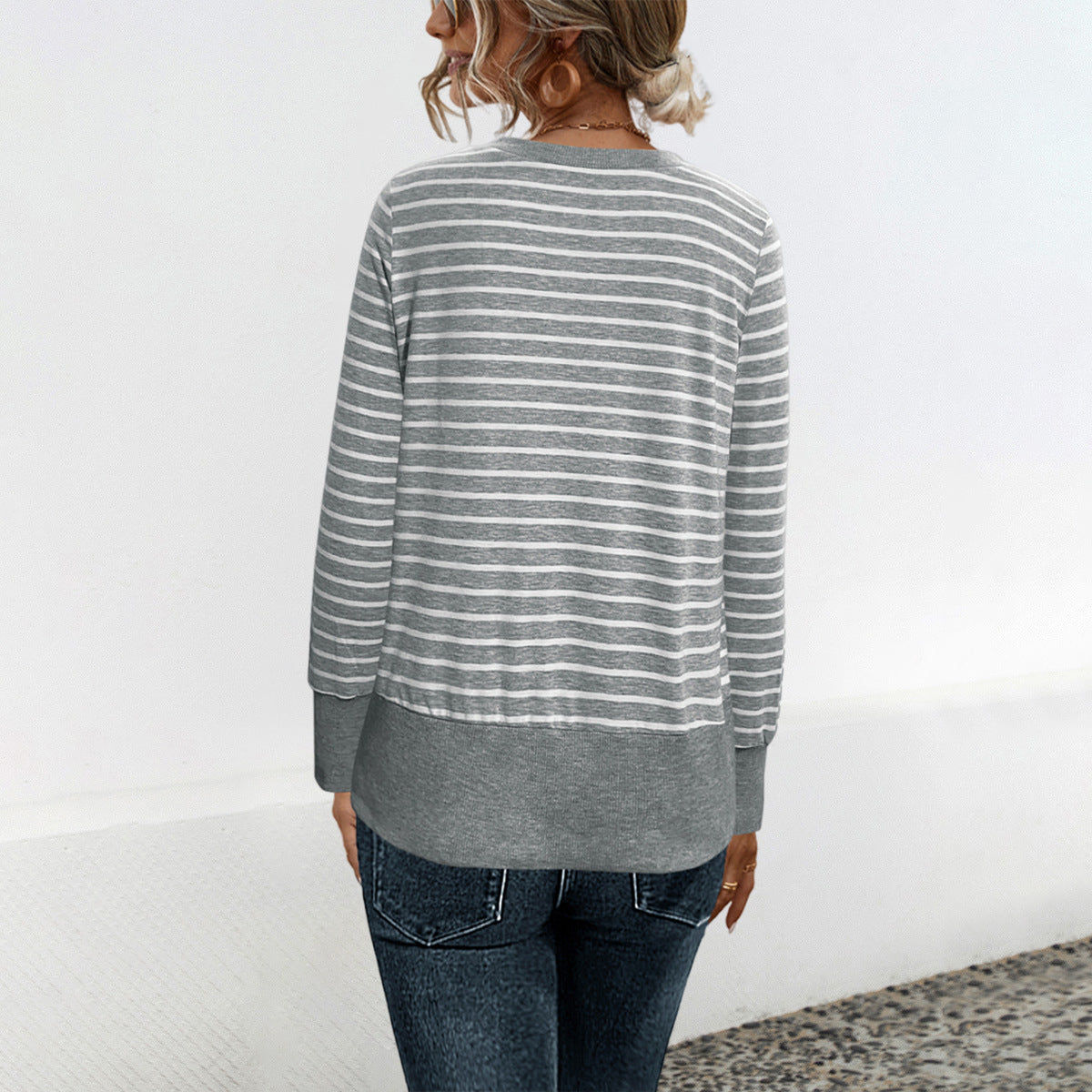 Women's gray striped cardigan, back view, long sleeves, banded hem