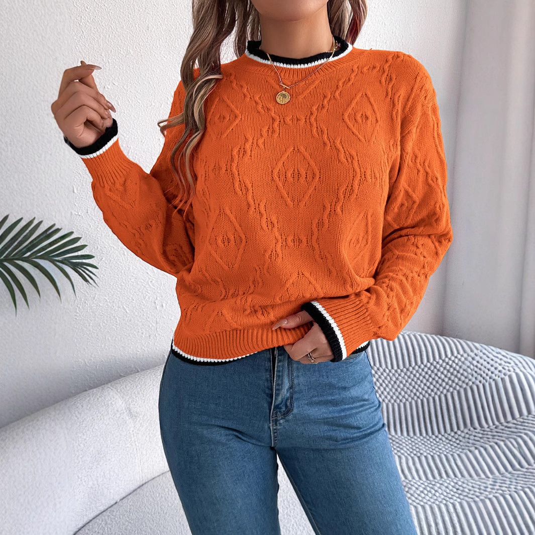 Orange cable-knit long-sleeve pullover sweater with round neckline, textured stitch pattern