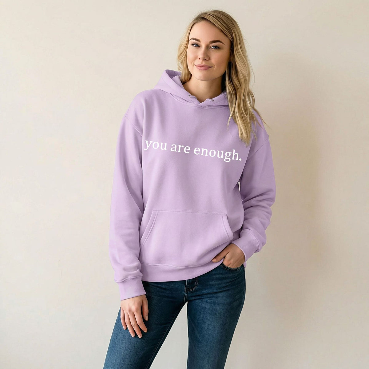 Lavender women’s hoodie sweatshirt with hood, kangaroo pocket, and 'you are enough' print.