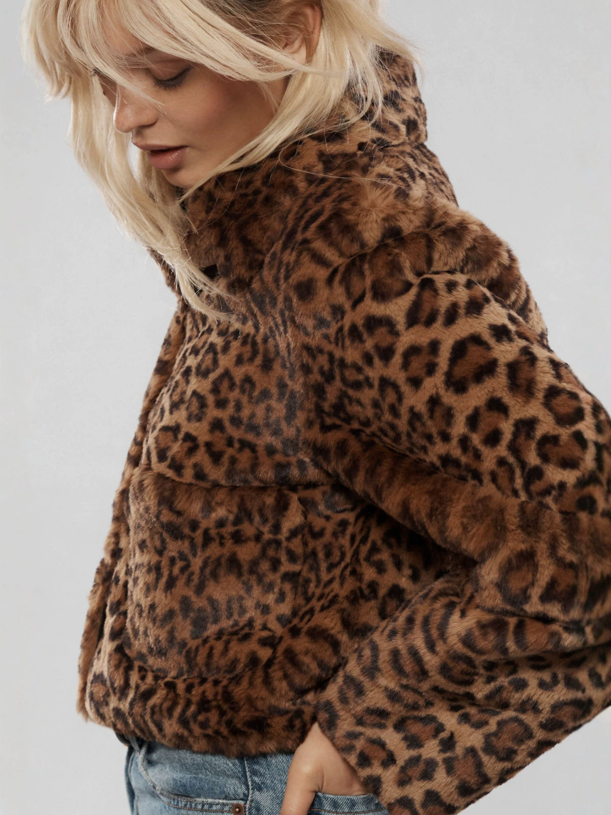 Leopard print faux fur short coat sleeve and shoulder details with plush pile