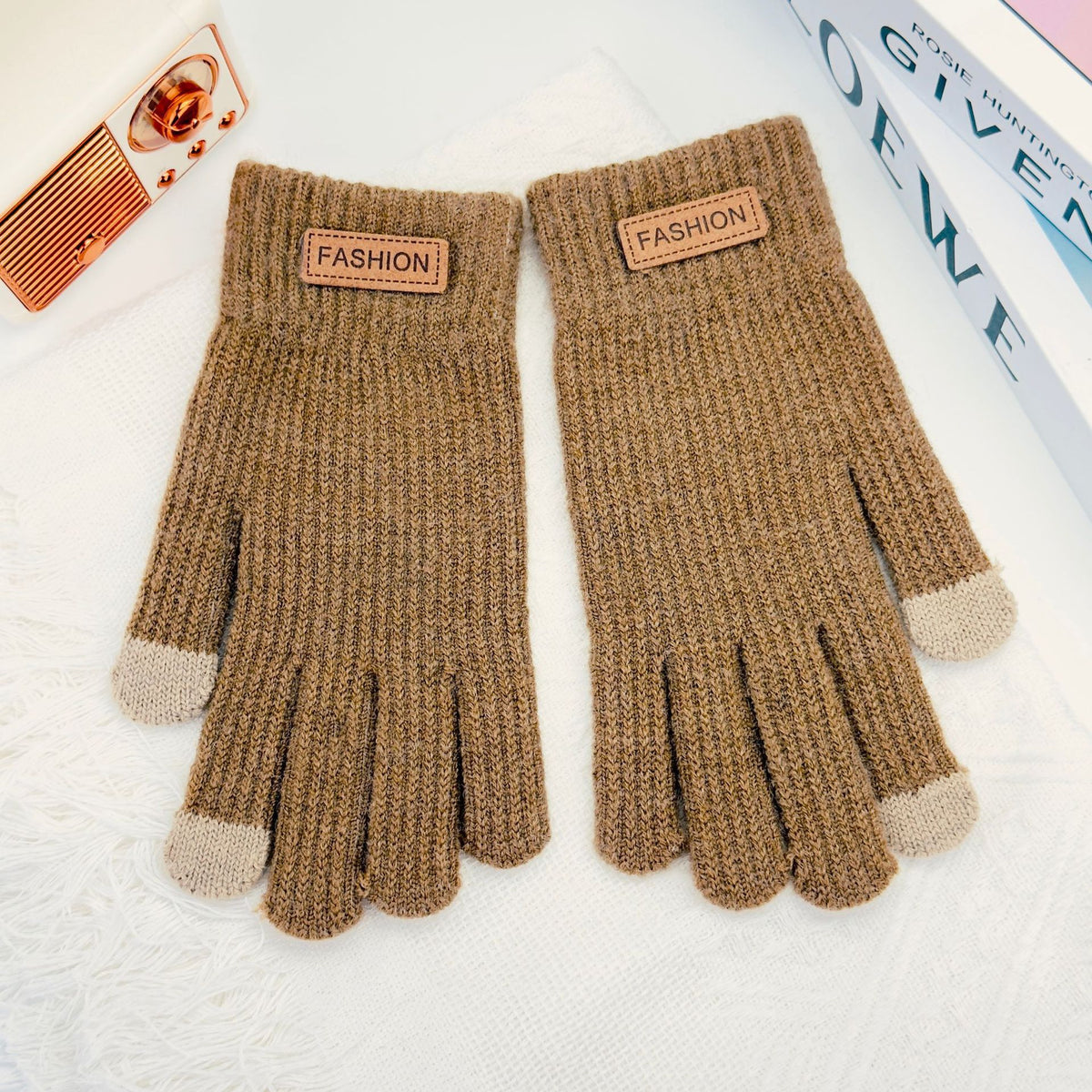 Brown knitted winter gloves with ribbed cuffs and five finger openings