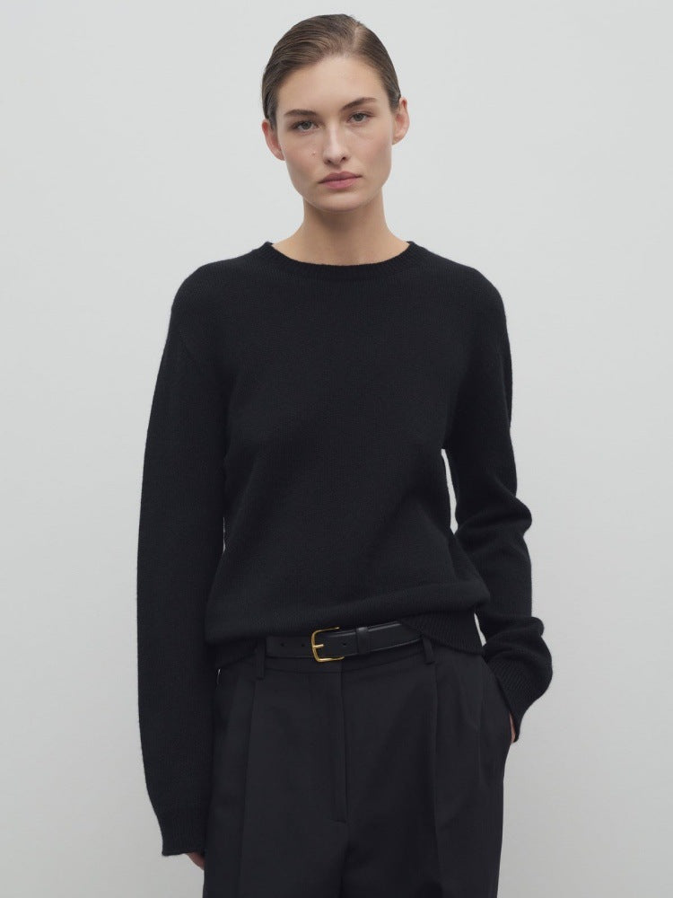 Women's black knit pullover with long sleeves and crew neckline, relaxed fit