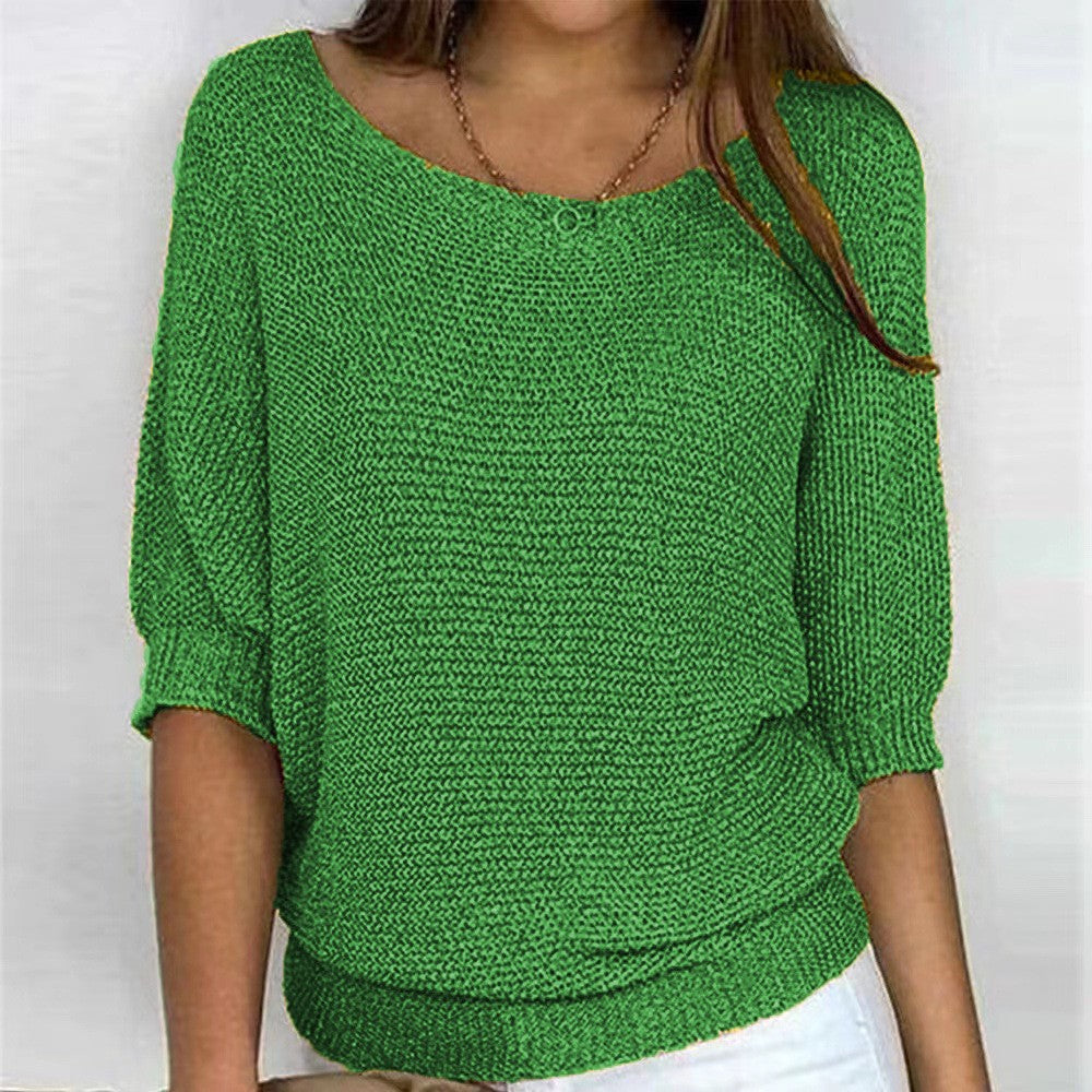 Green textured knit top with round neckline and three-quarter sleeves