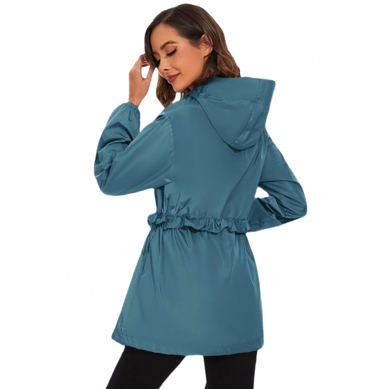 Blue hooded windbreaker jacket with full-zip front and drawstring waist, back view