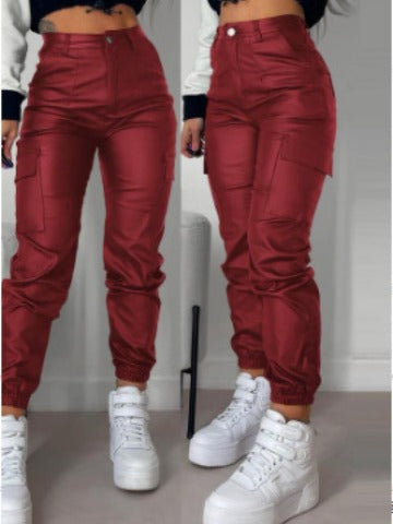 Wine red faux-leather slim-fit biker pants with zipper and pleated patch pockets