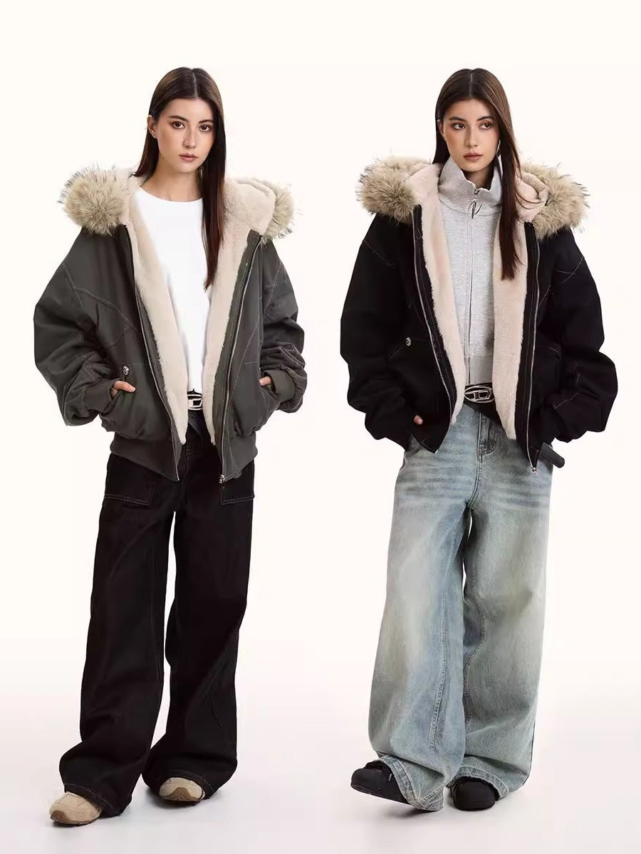 Hooded winter parka jacket with faux fur trim, zip front, and side pockets worn by two models