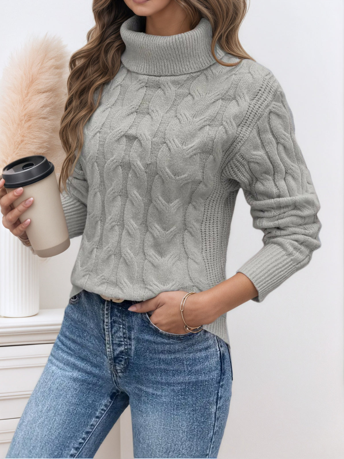 Grey knit turtleneck sweater with long sleeves and cable twist textured knit