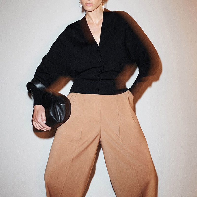 Black V-neck button-front cardigan with wide drop sleeves and boxy fit
