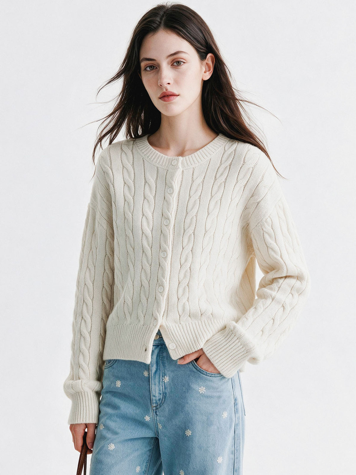 Women’s twist-knit cardigan in off-white, round neck, button-front, cable pattern, long sleeves