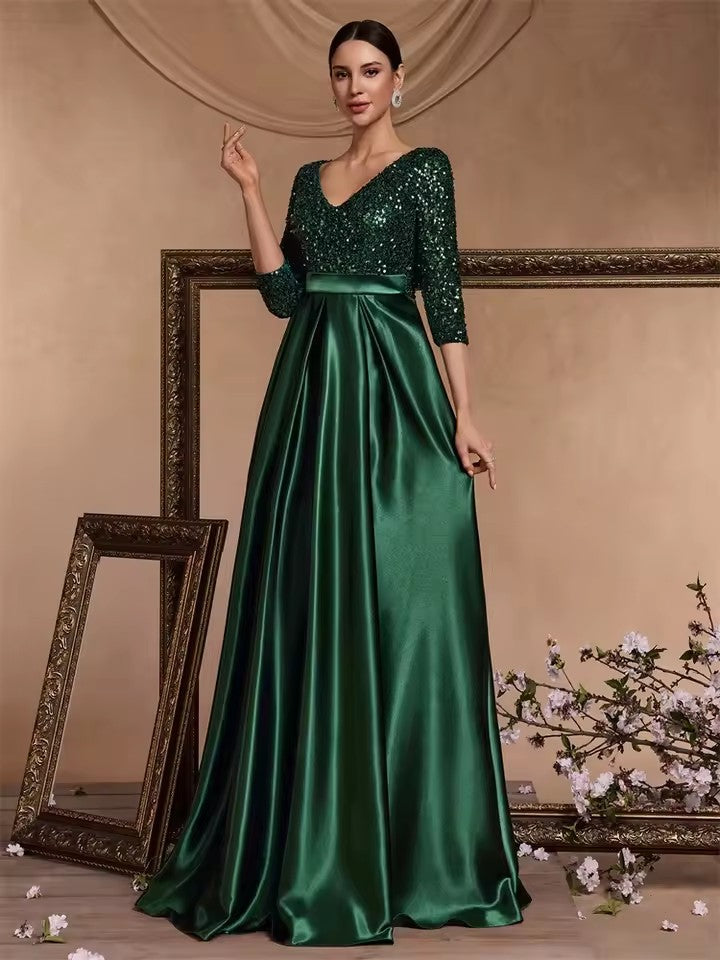 Dark green V-neck sequin evening dress with satin flared skirt, three-quarter sleeves