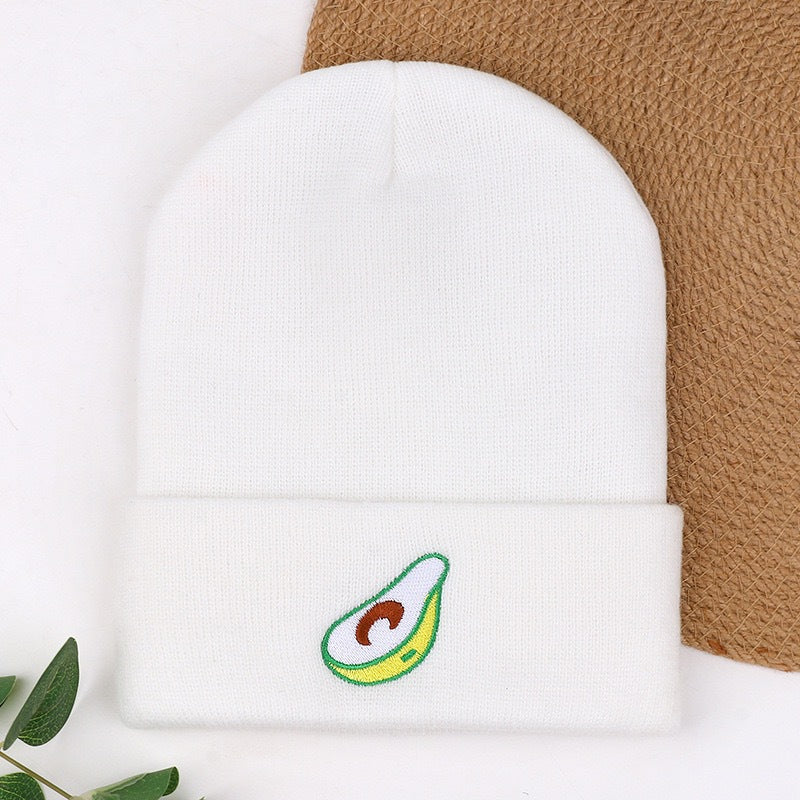 White ribbed knit beanie with green-and-orange swirl embroidered logo