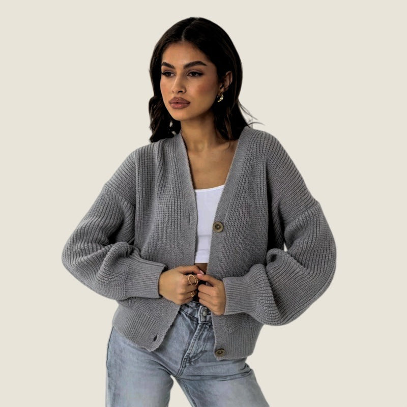 Women’s gray knitted cardigan sweater, button-front V-neck, chunky ribbed cuffs