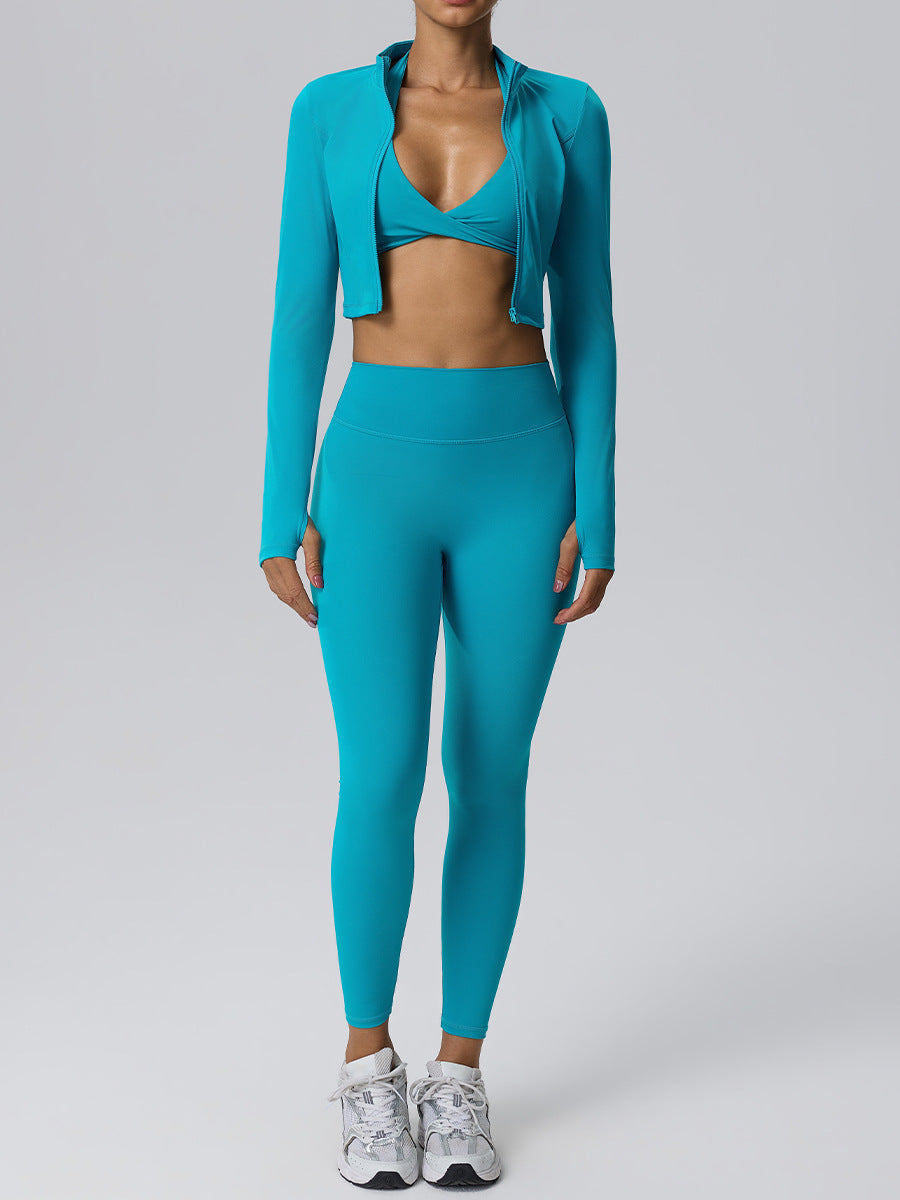 Women's blue-green yoga set with zip long-sleeve crop top and fitted leggings