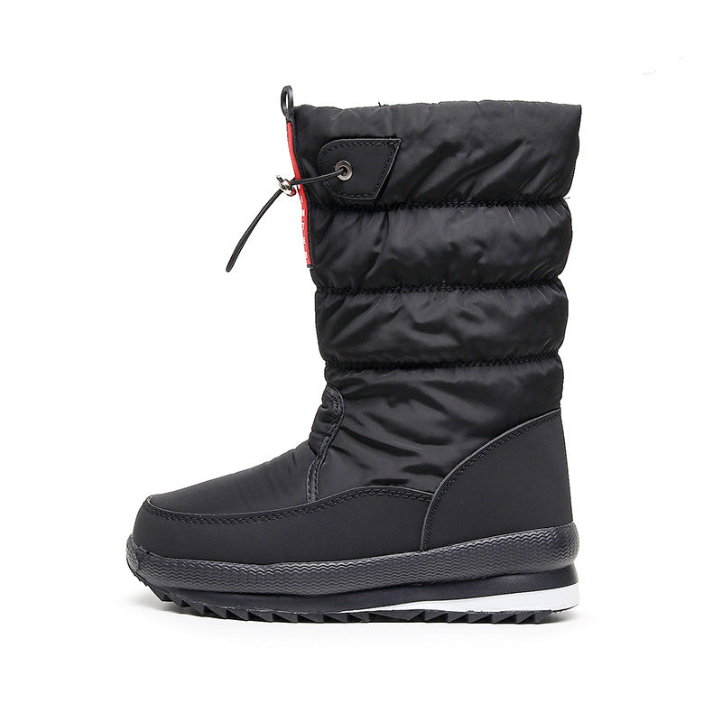 Black insulated mid-calf snow boot with quilted puffer upper, lace-up and tread sole.