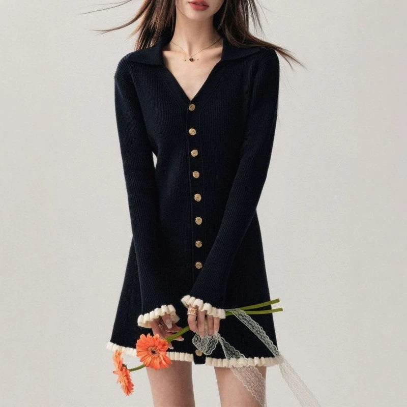 Black collared knit mini dress with gold buttons, ruffle hem, and long sleeves