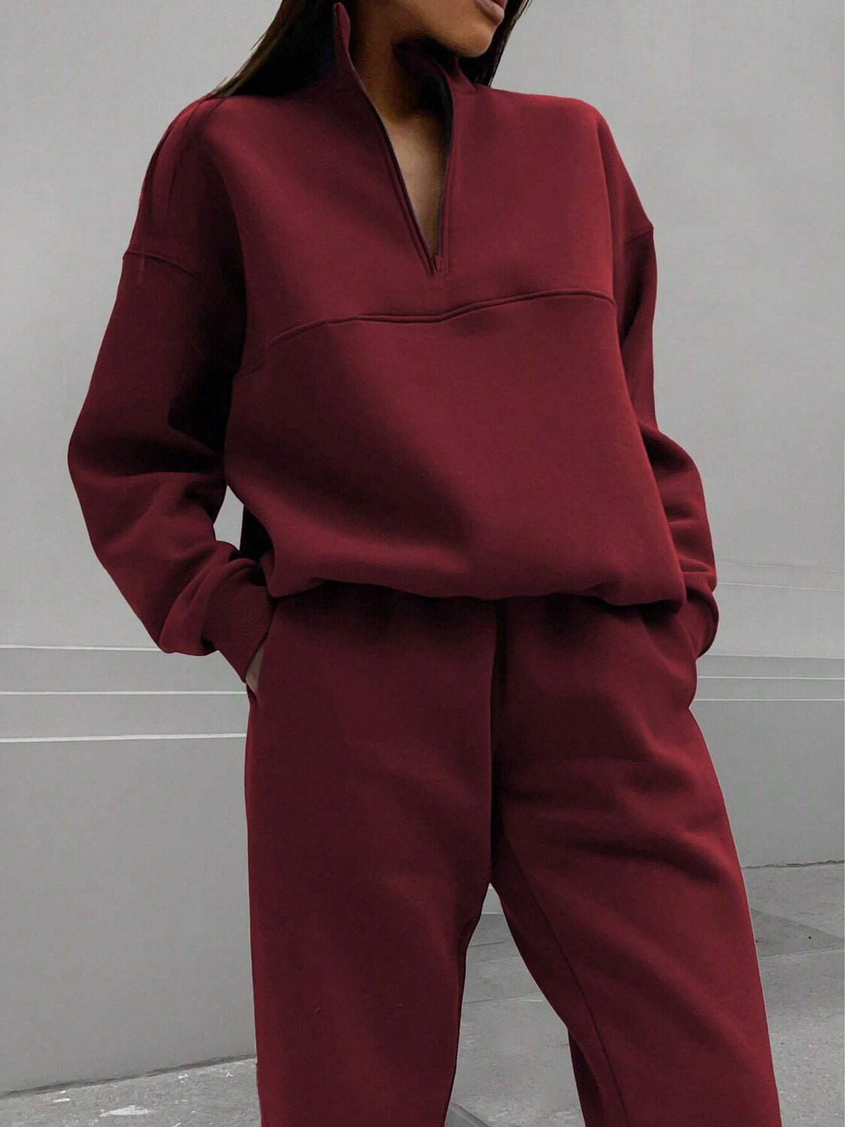Burgundy zip-lapel two-piece tracksuit set with quarter-zip pullover and tapered joggers