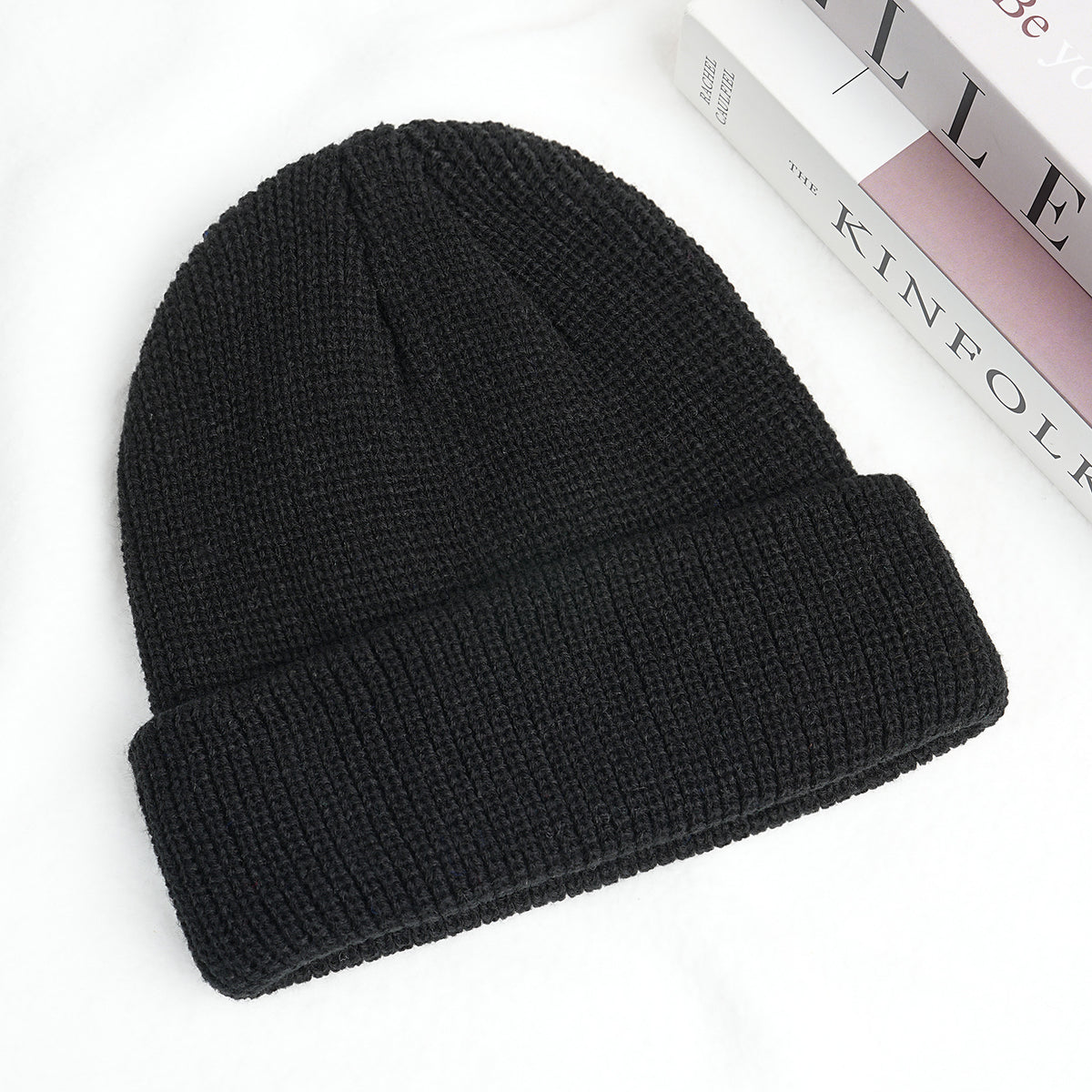 Thick knitted beanie hat in black with ribbed cuff and folded brim