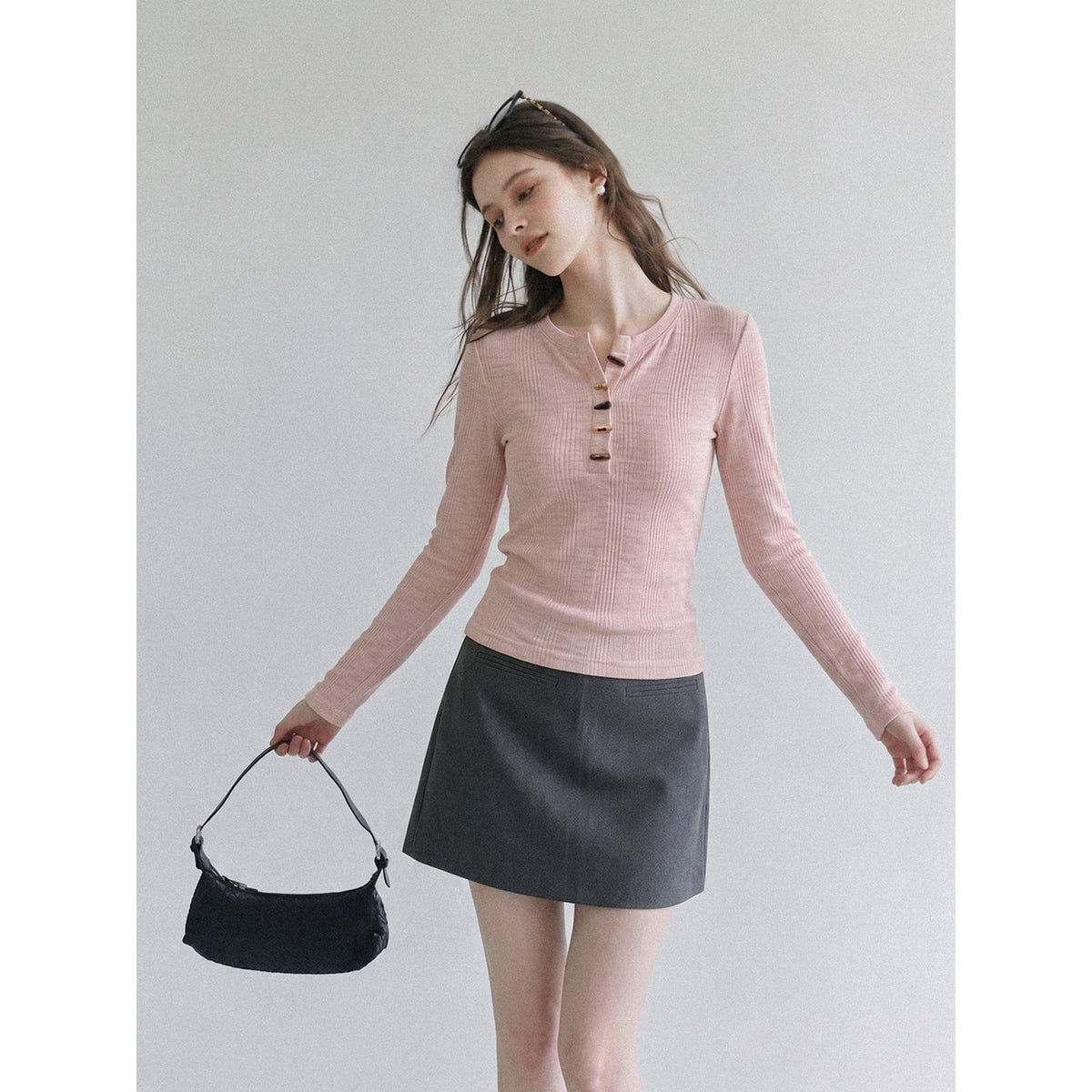 Women's pink long-sleeve henley T-shirt with horn-button half placket, fitted long sleeves