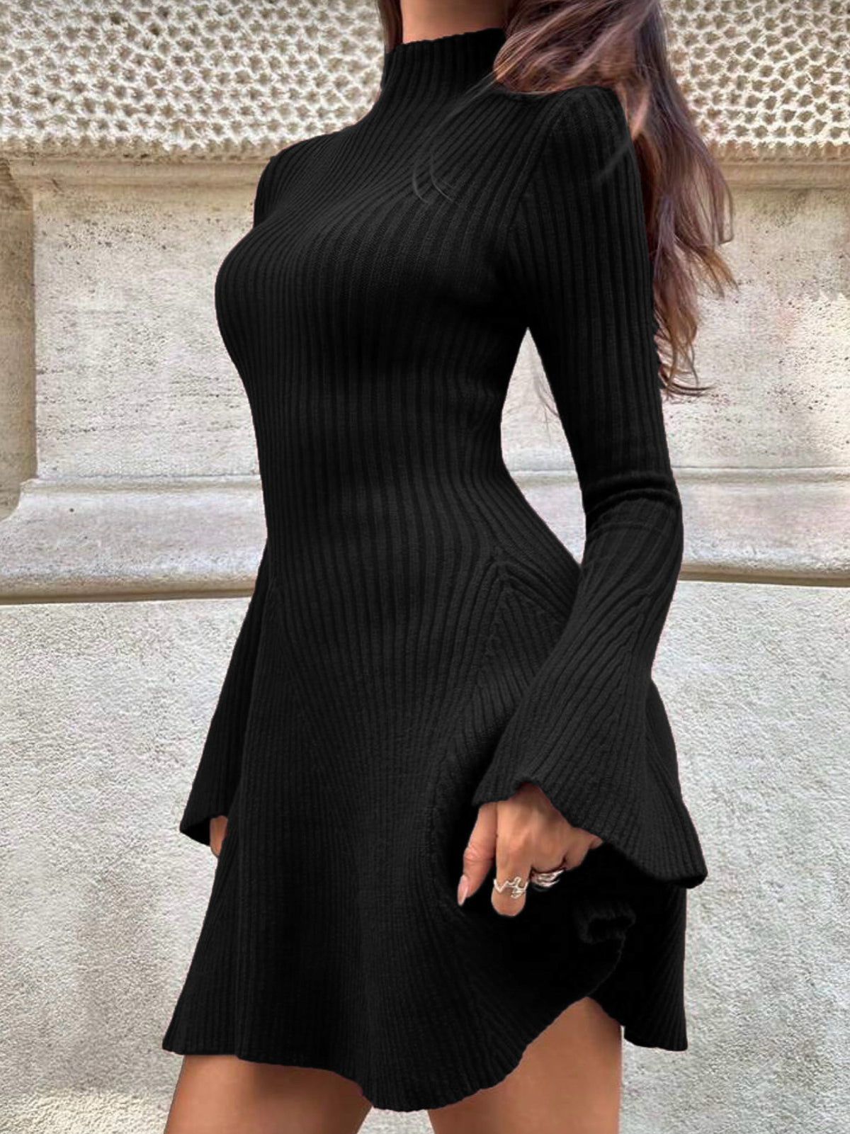 Black knit sweater dress with high neck, long sleeves, ribbed fitted waist and A-line hem