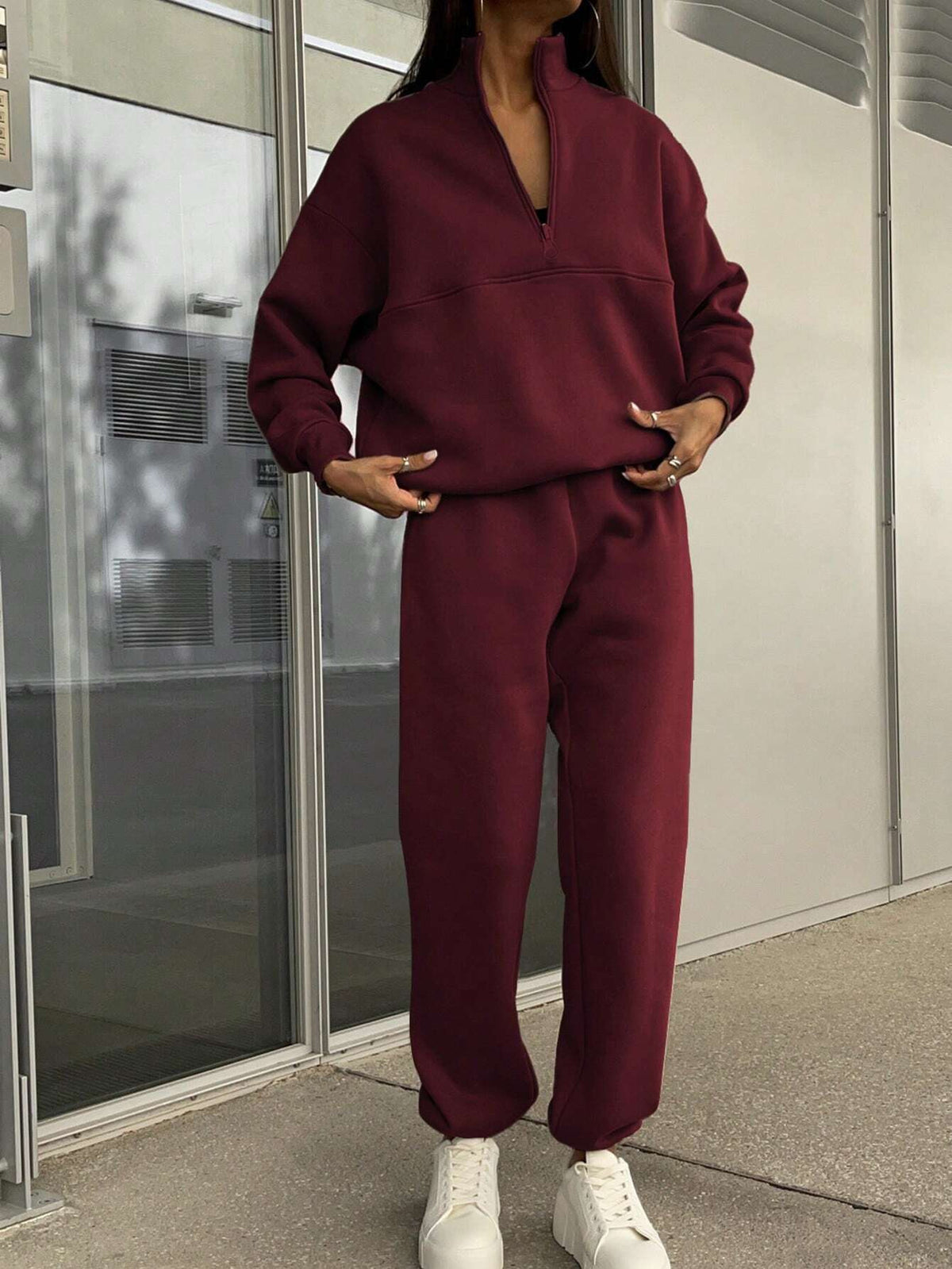 Burgundy zip-lapel two-piece tracksuit set with quarter-zip pullover and relaxed joggers
