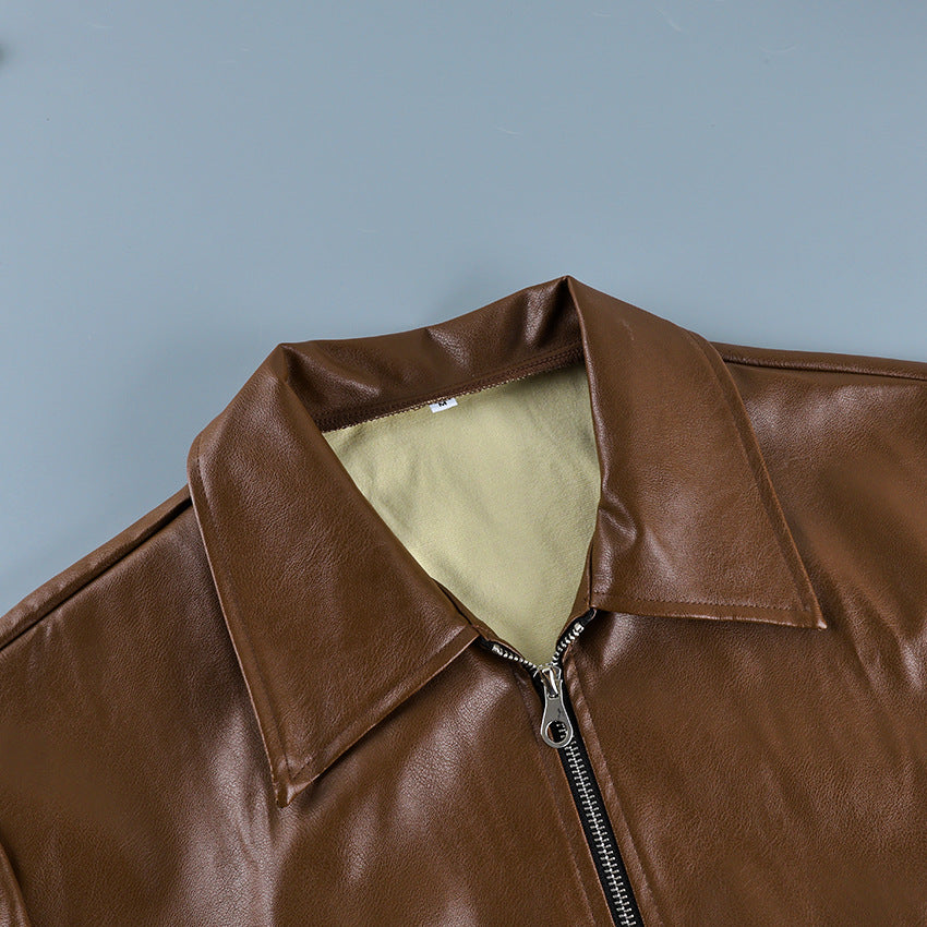 Brown leather motorcycle jacket collar and zip front detail with cream lining