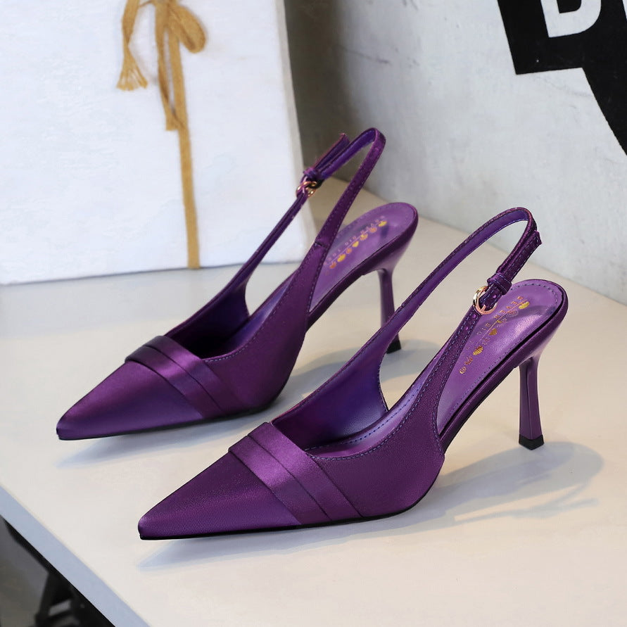 Purple satin pointed-toe stiletto slingback heels with cut-out back strap