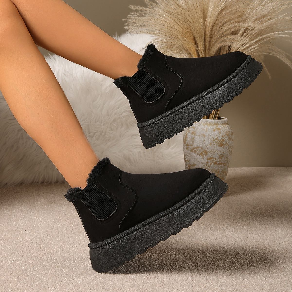 Women's black plush-lined ankle boots with round toe, elastic side gore, thick sole